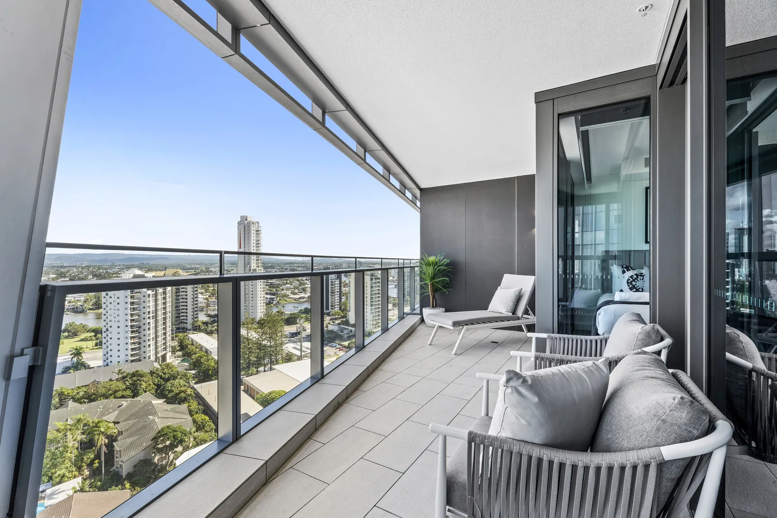 High-rise balcony with rope outdoor lounge setting and Gold Coast skyline views